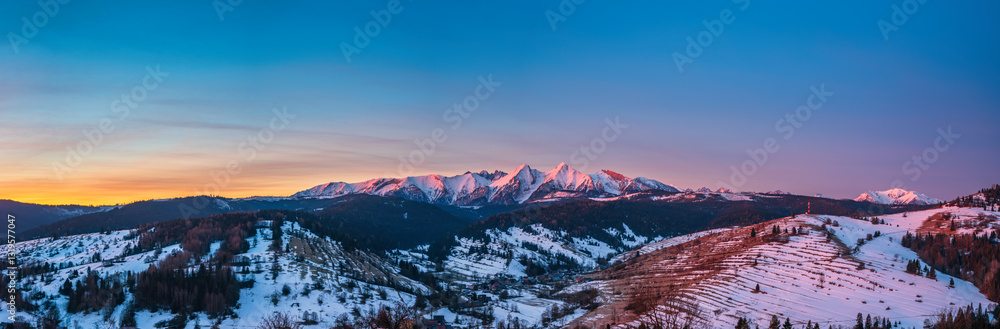 Panoramic view of Belianske Tatras mounains at sunrise seen from Slovakia in Osturnia region