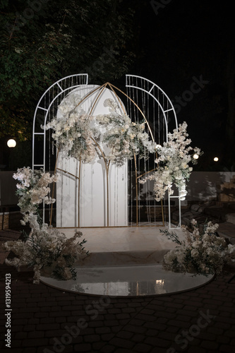 Wedding arch for the ceremony on a background of nature in the dark	