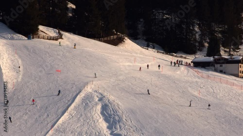 Skiors on ski slopes runs in Davos, Swiss Alps, Switzerland February 2025