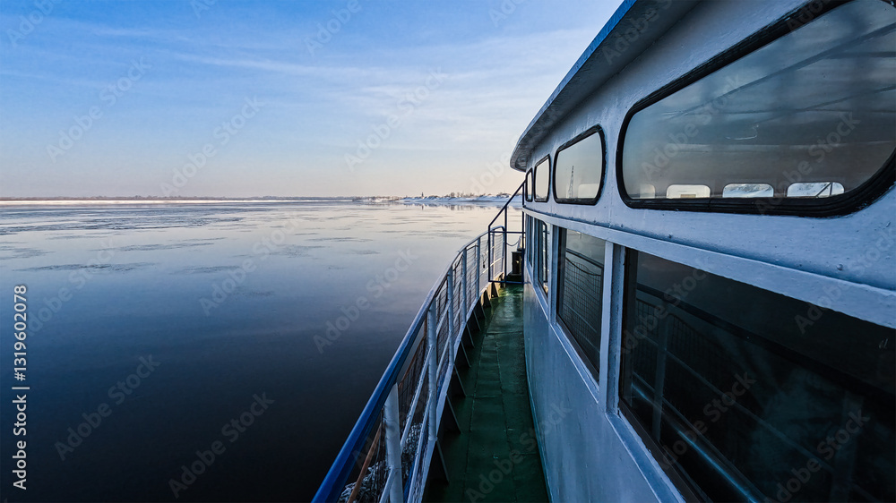 View of a boat moving on a winter river View of a boat moving on a winter river