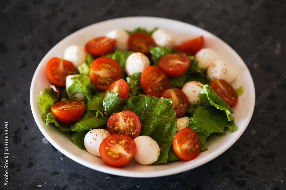 Salad with mozzarella balls tomatoes and mix salad Salad with mozzarella balls tomatoes and mix salad