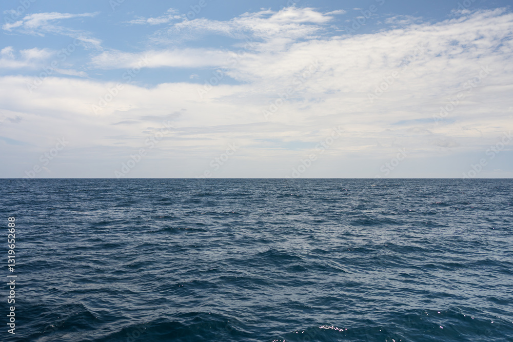Side view from boat in Indian ocean sailing between Seychelles islands in daytime Side view from boat in Indian ocean sailing between Seychelles islands in daytime