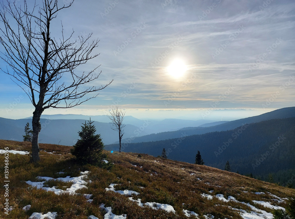mountains in Slovenia. Winter landscape with bright sun. View form Pohorje mountains to horizon