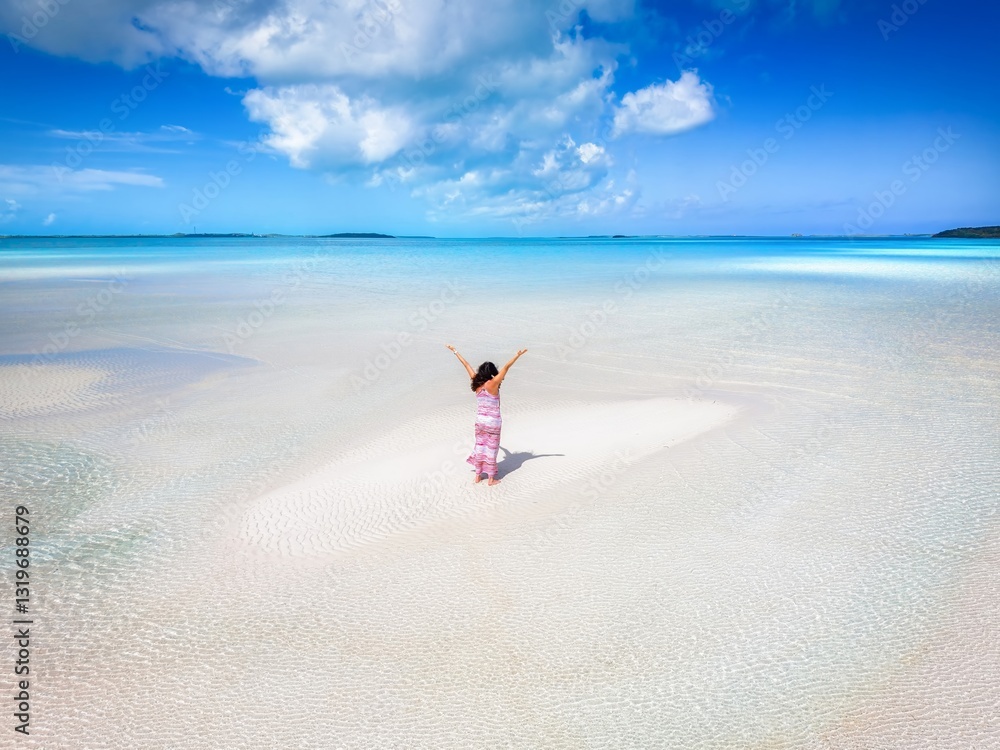 A holiday woman on a sandbar beach with turquoise, clear water as a tropical travel concept, Exuma islands, Bahamas