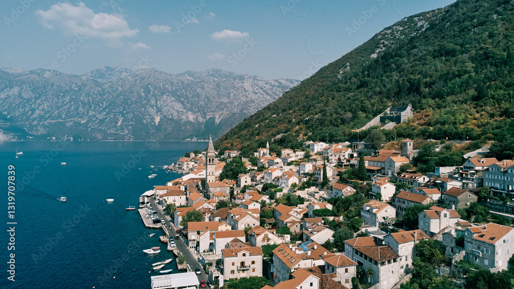 Boats are moored at the piers of the coast of Perast. Montenegro. Drone Boats are moored at the piers of the coast of Perast. Montenegro. Drone