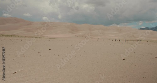 Slider Pan of CO Great Sand Dunes as People Walk in the Distance