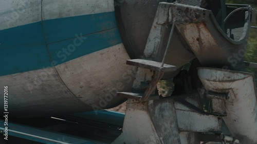 Concrete mixer truck unloading at construction site