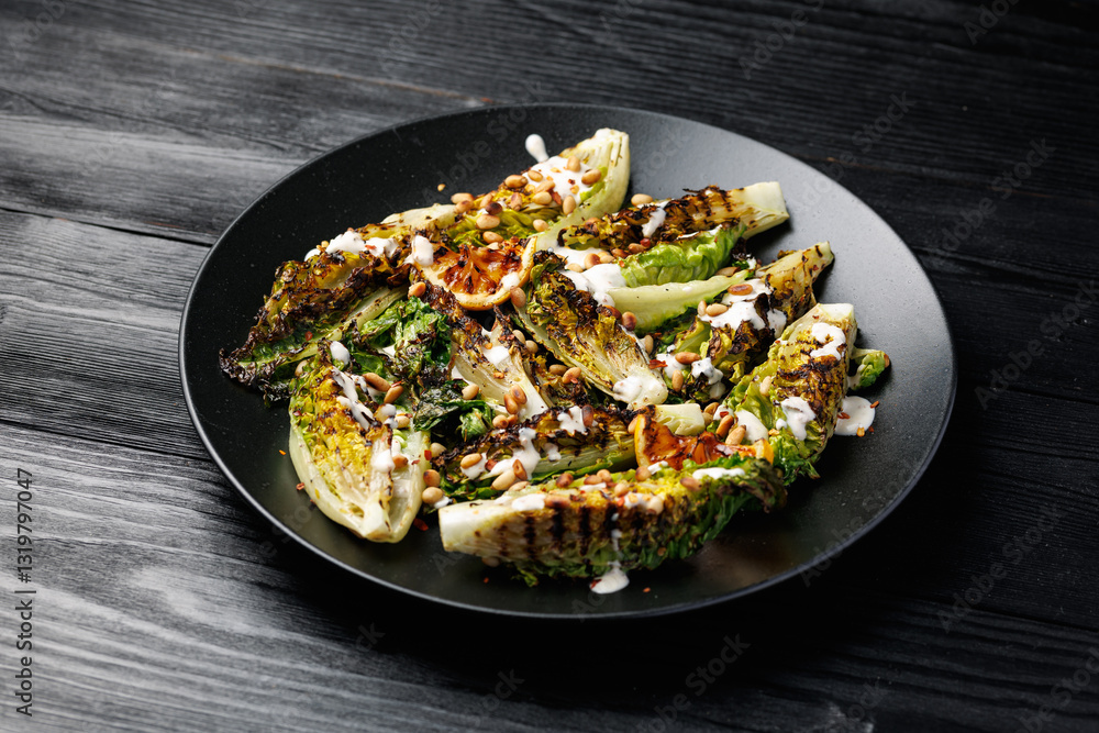 Grilled little gem lettuce with aioli sauce, roasted pine nuts and chilli flakes. Healthy Low carb side salad Grilled little gem lettuce with aioli sauce, roasted pine nuts and chilli flakes. Healthy Low carb side salad