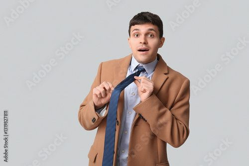 Surprised young man straigh...