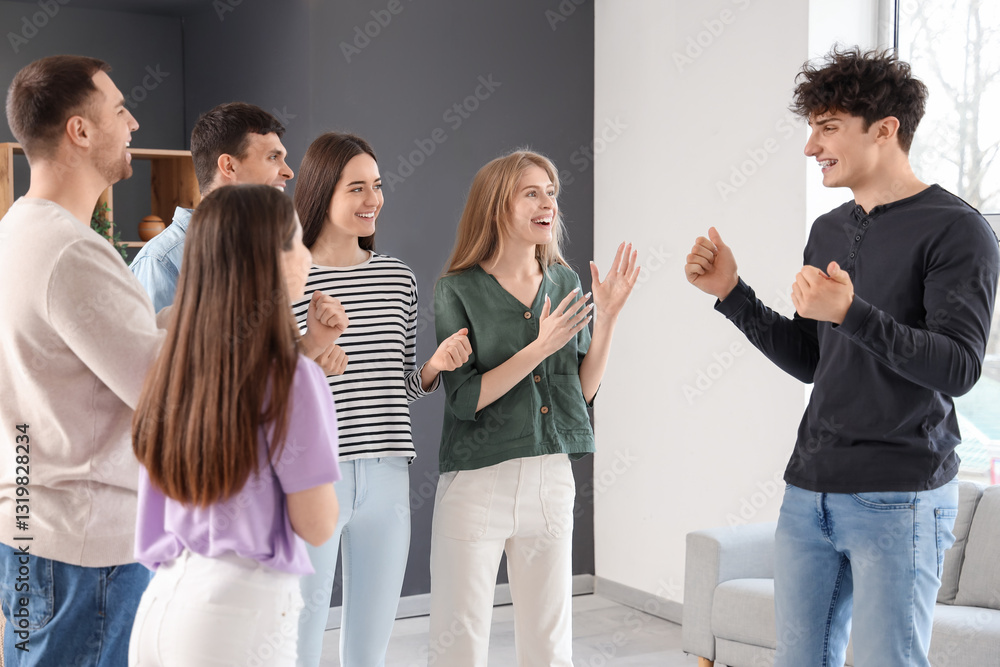 Fotografie Happy young man talking at group therapy session