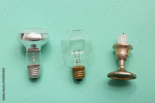Light bulbs and candle on t...