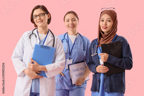Female doctors with clipboa...
