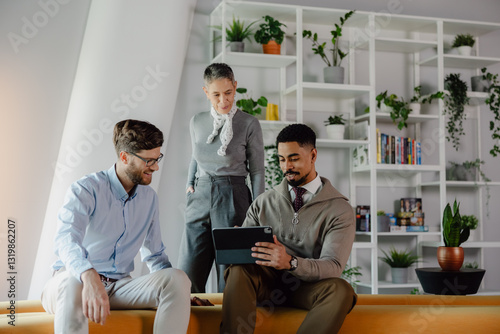 Team Discussing Ideas Together in a Modern and Green Office Space
