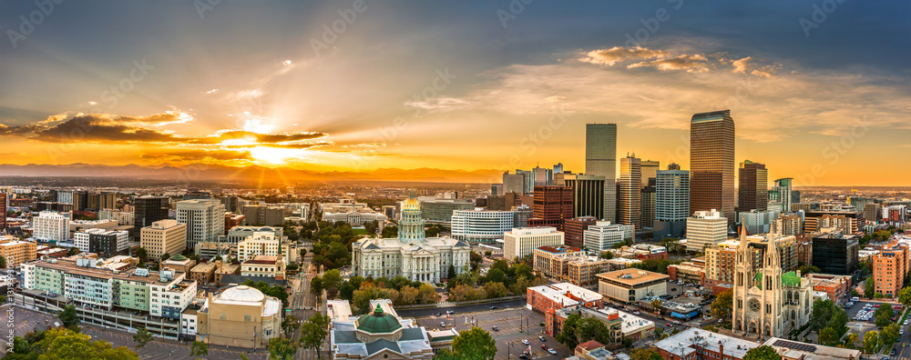 Aerial panorama of Colorado Capitol and Denver, Colorado skyline at sunset. Denver is a consolidated city and county, the capital, and most populous city of the U.S. state of Colorado