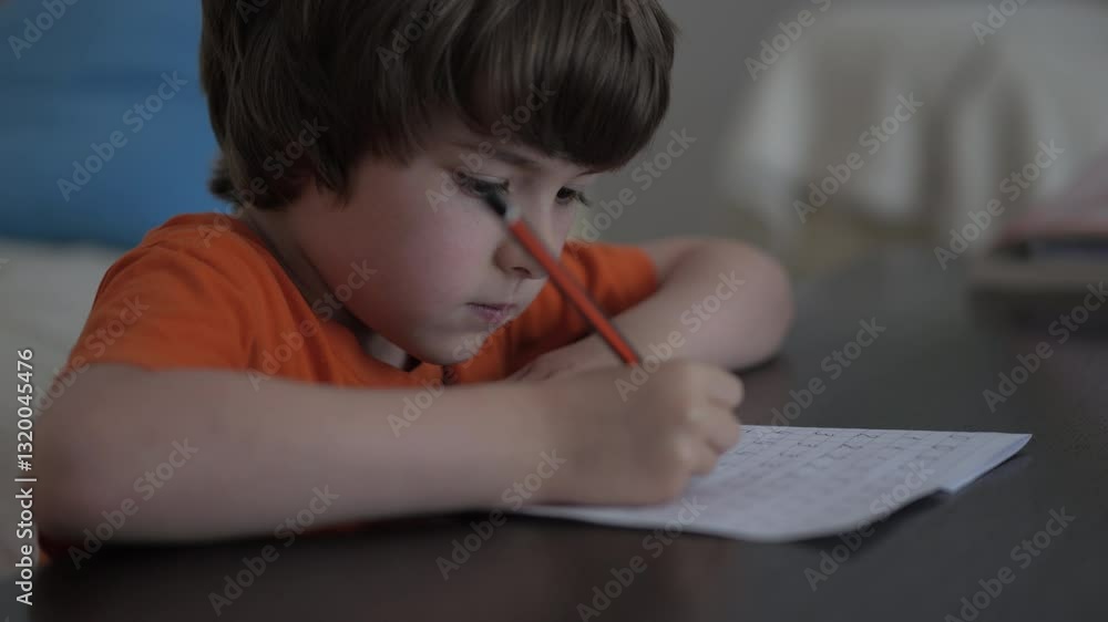 School Boy Practicing Writing Numbers at Home. Child Working on His Homework. Little Boy Studying Learning at Home. Child, Learning Doing Math for Education, Making Homework Numbers in His Room. School Boy Practicing Writing Numbers at Home. Child Working on His Homework. Little Boy Studying Learning at Home. Child, Learning Doing Math for Education, Making Homework Numbers in His Room.
