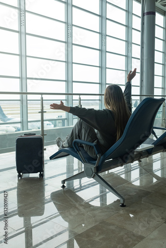 happy young latina girl resting and waiting for her plane to go on vacation