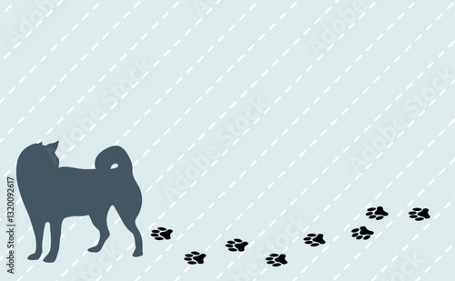 足跡をつけながら歩く犬のシルエット