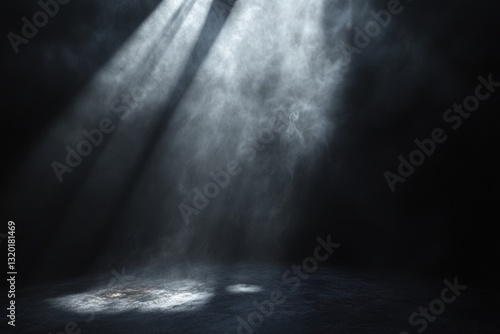 Dramatic spotlight illuminating smoky, dark room.