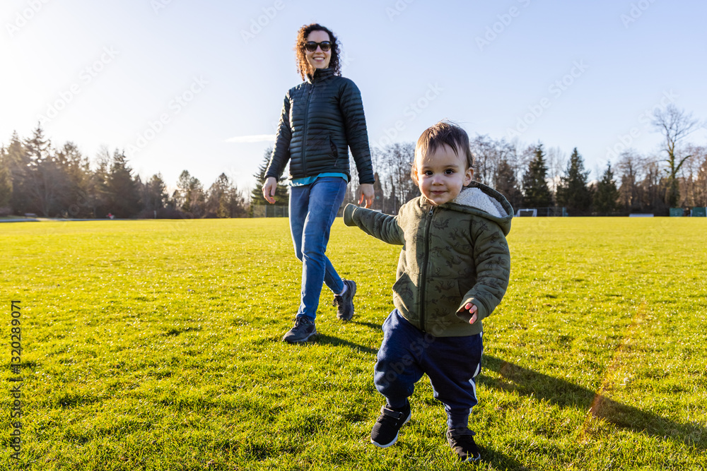Mother Enjoying Playtime Outdoors With Child on a Sunny Day Mother Enjoying Playtime Outdoors With Child on a Sunny Day