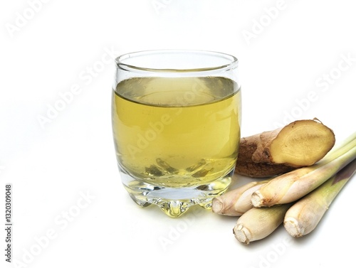 Boiled lemongrass and ginger water in a glass on white background, healthy drink lifestyle  photo