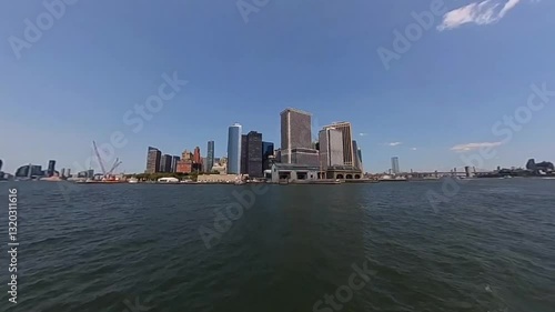 Wallpaper Mural A stunning panoramic view of the iconic NYC skyline against clear skies and a tranquil water foreground Torontodigital.ca