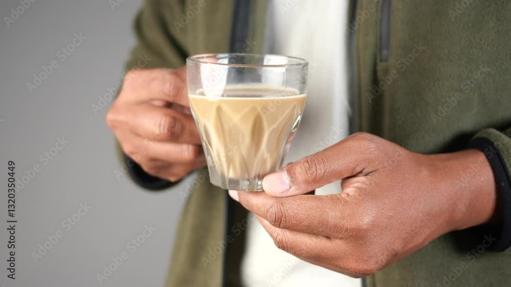 Enjoying a warm cup of coffee in cozy setting Enjoying a warm cup of coffee in cozy setting