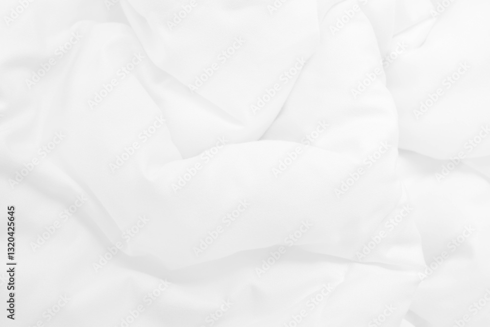 Close up top view of white bedding sheet and wrinkle messy blanket in bedroom after wake up in the morning.
