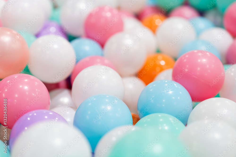 A close-up shot of a large pile of colorful plastic balls, creating a vibrant and playful background. A close-up shot of a large pile of colorful plastic balls, creating a vibrant and playful background.