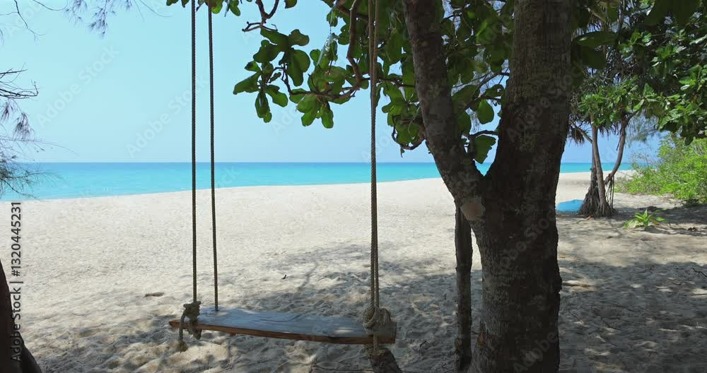 Beach swing hanging from tree with ocean view, playful and relaxing. Warm tones, perfect for lifestyle blogs or resort promotions. Beach swing hanging from tree with ocean view, playful and relaxing. Warm tones, perfect for lifestyle blogs or resort promotions.