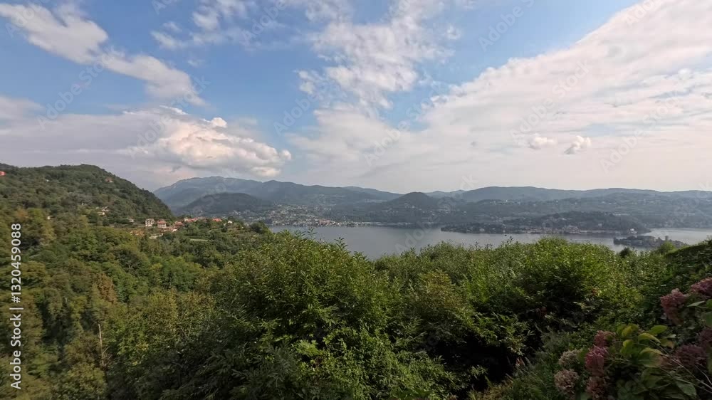 Timelapse video showcasing the stunning view of Sondrio, Italy, transitioning from day to night. Beautiful lake, mountains, lush greenery Timelapse video showcasing the stunning view of Sondrio, Italy, transitioning from day to night. Beautiful lake, mountains, lush greenery