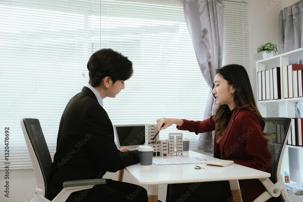Fototapeta premium Clients consult with real estate agents to invest in homes, apartments or condominiums, mortgage options and property values, and find deals for ownership, rental or sale.