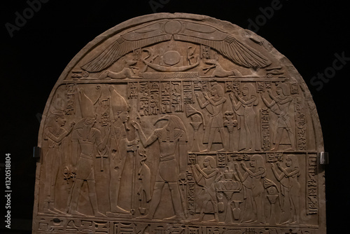 ancient Egyptian carvings and hieroglyphs on sand stones at the Grand Egyptian Museum in Cairo, Egypt
