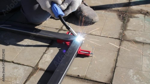 repair work with metal using a welding machine 