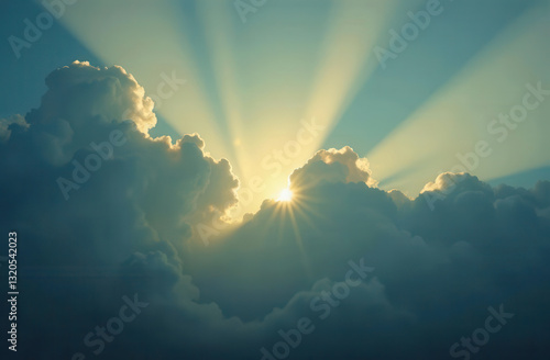 sun peeking through blue clouds. rays of divine light. natural abstract background with copy space