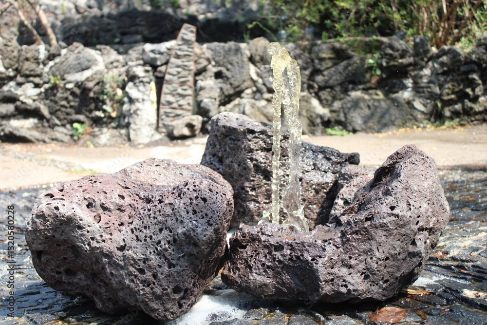 Jet of water emerges from volcanic rocks
Jet of water emerges from volcanic rocks