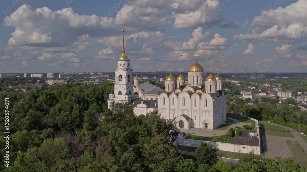 A stunning aerial view reveals a majestic cathedral with golden domes nestled among lush greenery and modern buildings. The sky is filled with fluffy clouds and sunlight. A stunning aerial view reveals a majestic cathedral with golden domes nestled among lush greenery and modern buildings. The sky is filled with fluffy clouds and sunlight.