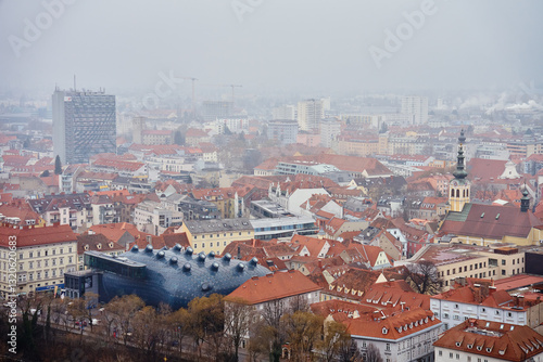 Obraz na płótnie Graz cityscape on foggy day. Panoramic view of Graz, Austria with historical architecture. Streets with red roofed buildings in European city w salonie