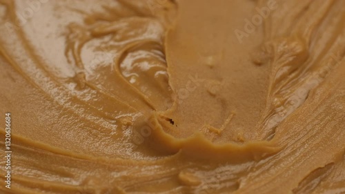 Wallpaper Mural Scooping with golden spoon creamy peanut butter, close up Torontodigital.ca