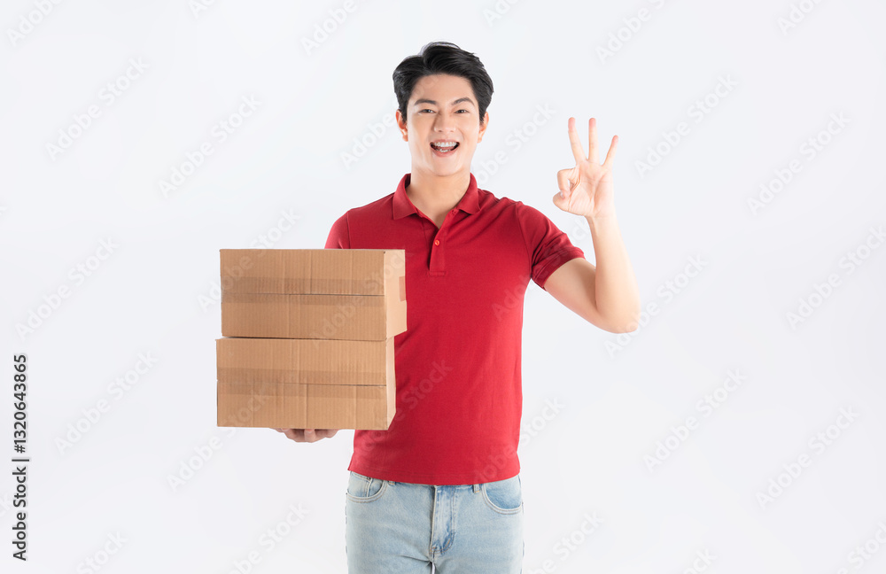 Portrait of delivery asian man holding box on white background Portrait of delivery asian man holding box on white background
