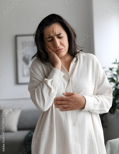 Obraz na płótnie Young woman suffering from severe abdominal pain at home w salonie
