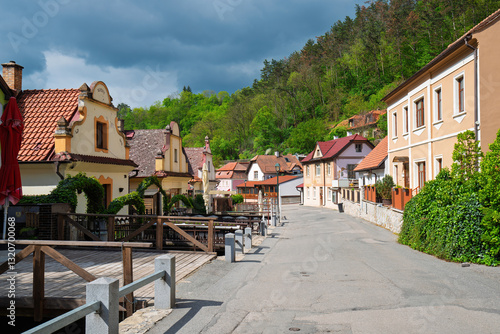 Traditional houses lining a charming street in Karlstejn, Czech Republic, creating an idyllic scene