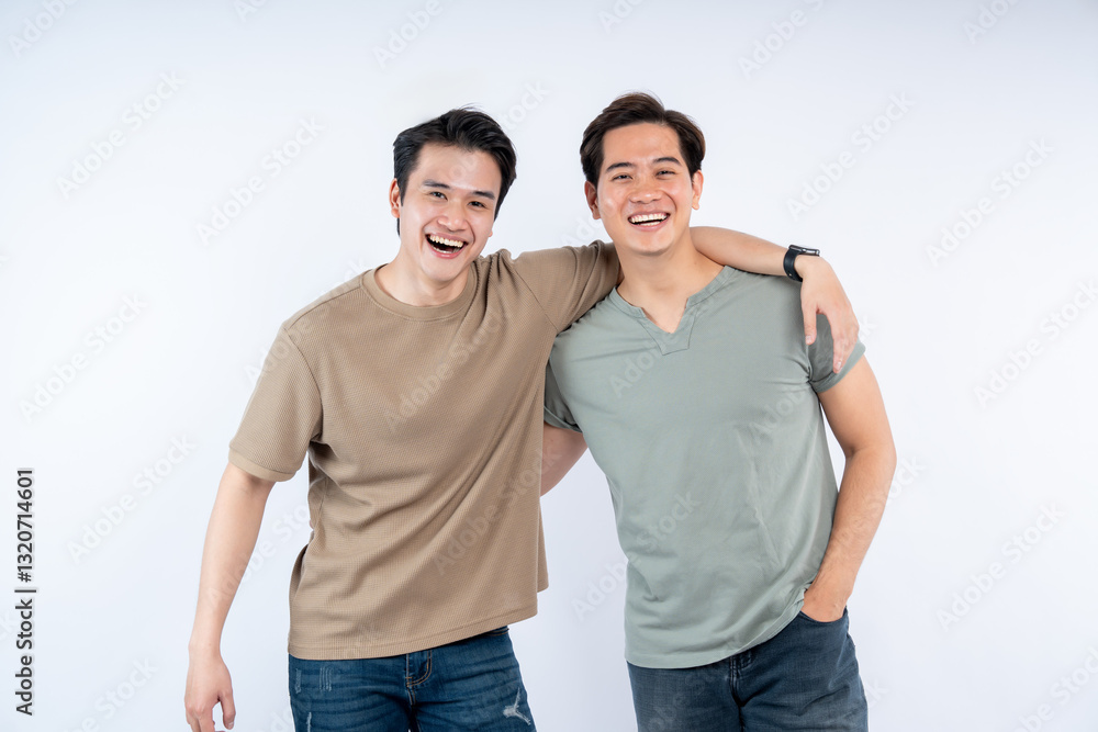 Two Smiling Men: Friends or Brothers. Casual, Happy People. Asian ethnicity. Studio shot, white background. Authentic, Friendly. Positive Vibes. Two Smiling Men: Friends or Brothers. Casual, Happy People. Asian ethnicity. Studio shot, white background. Authentic, Friendly. Positive Vibes.