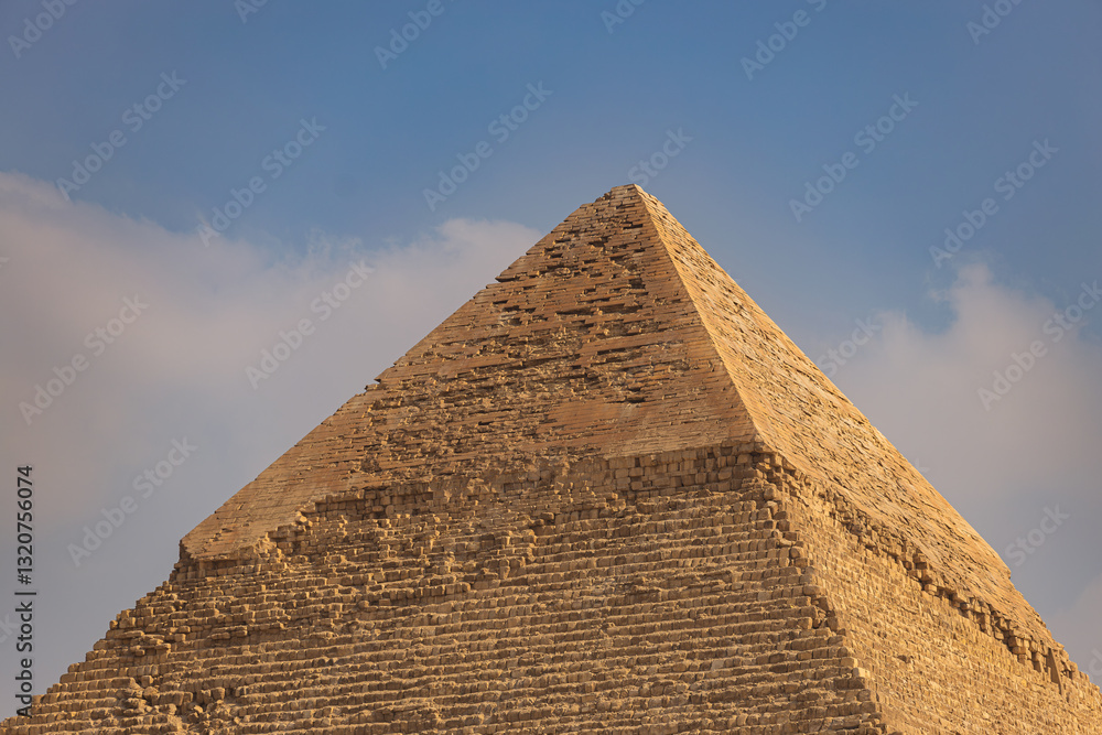 The peak of the Pyramid of Khafre, distinguished by the remains of its original limestone casing, offering a glimpse of how pyramids appeared in their prime The peak of the Pyramid of Khafre, distinguished by the remains of its original limestone casing, offering a glimpse of how pyramids appeared in their prime
