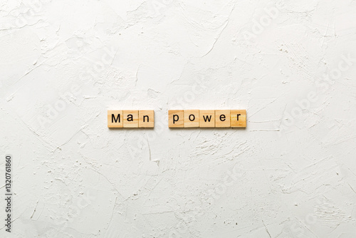 Valokuva Man Power word written on wood block