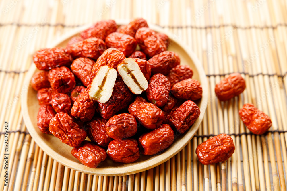 Dried red Chinese dates, jujube in a bowl Dried red Chinese dates, jujube in a bowl
