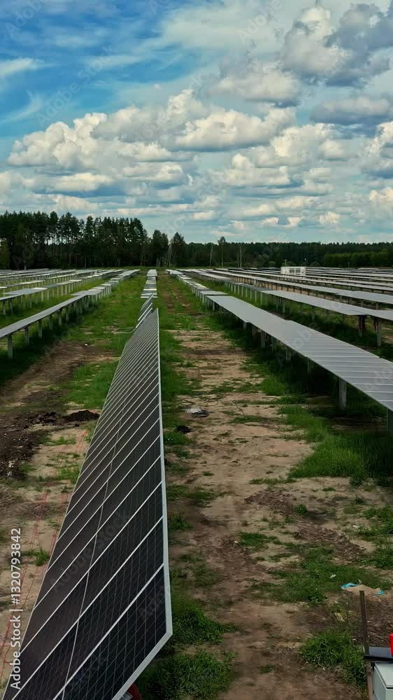 Solar park in industrial farm field. Aerial vertical view Solar park in industrial farm field. Aerial vertical view