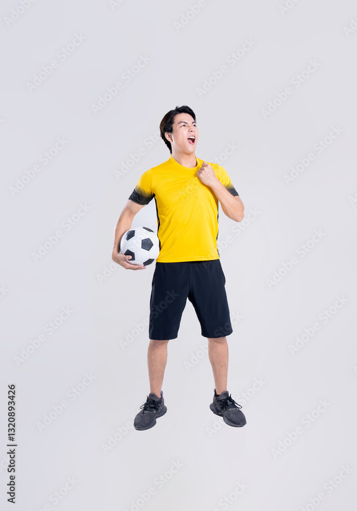 Portrait of Asian man playing soccer on white background Portrait of Asian man playing soccer on white background