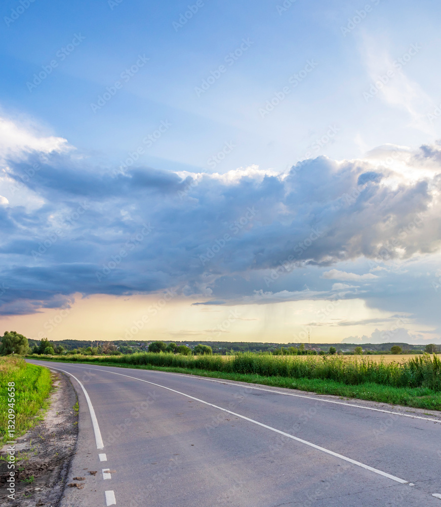Road with a cloudy sky in the background Road with a cloudy sky in the background