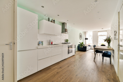 Wallpaper Mural A stylish modern kitchen featuring sleek cabinetry, a minimalist design, and an open layout that connects seamlessly with the dining area. Natural light enhances its appeal. Torontodigital.ca
