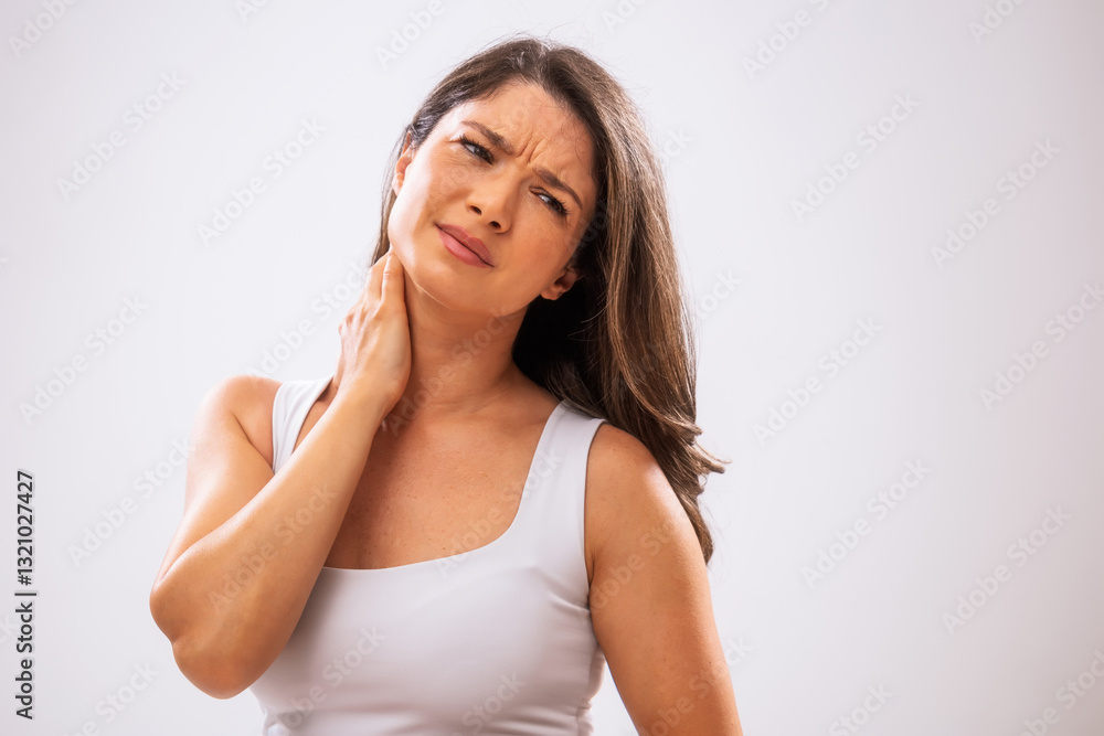 Portrait of adult woman who is having sprain in her neck. Portrait of adult woman who is having sprain in her neck.